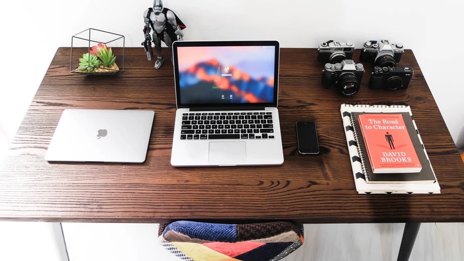 Designer's desk with a laptop and camera